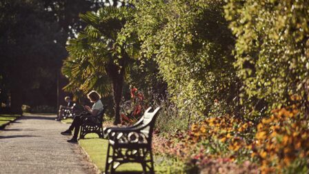 People sat on benches in gardens - Colchester - Beresfords Estate agents - Essex