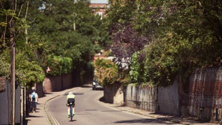 Man cycling down road - Dedham - Beresfords Estate agents - Essex