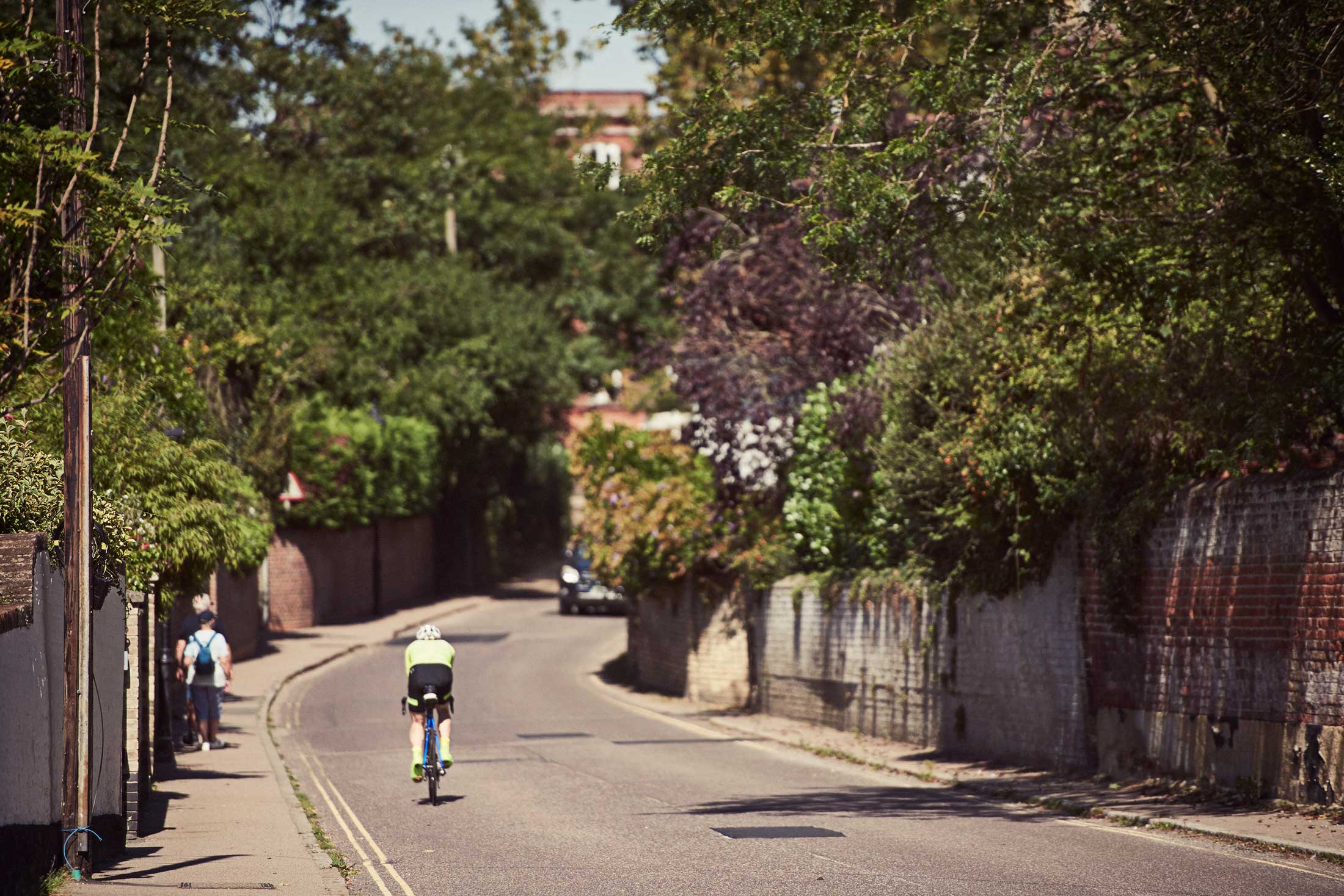 Man cycling down road - Dedham - Beresfords Estate agents - Essex