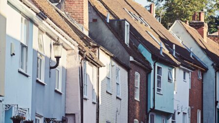 Man cycling by colourful houses - Colchester - Beresfords Estate agents - Essex