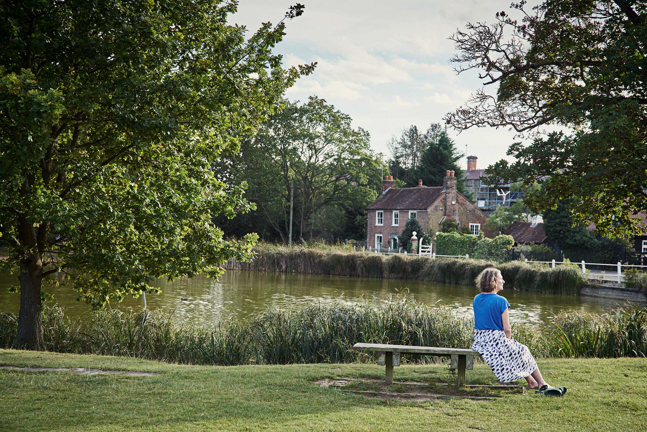 Woman sat on bench by river - Shenfield - Beresfords Estate agents - Essex