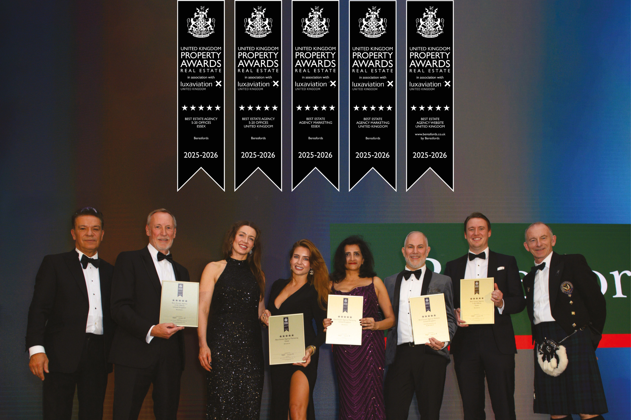 Beresfords team on stage accepting multiple national property awards at the International Property Awards 2025